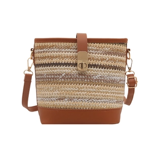 Stylish woven PU leather bucket bag with brown adjustable strap for summer vacations