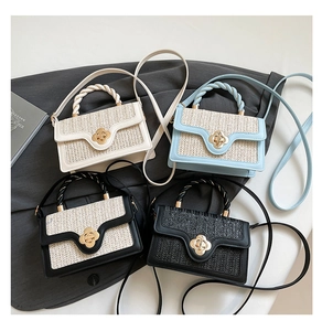 Detail of straw woven crossbody bags with golden flower twist locks in four colors