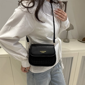 Chic black leather crossbody square bag with gold lettering and jacquard pattern