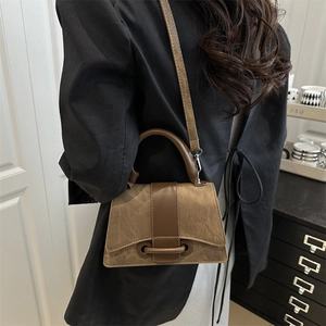 Retro brown crossbody square bag in matte texture with unique hollow design and top handle