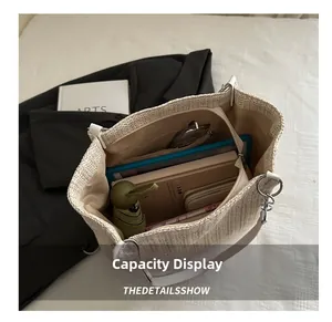 Spacious beige woven tote showing internal capacity with a secure zipper pocket