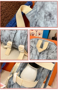 Detail showing marble print fabric, reinforced stitching, and adjustable bag straps