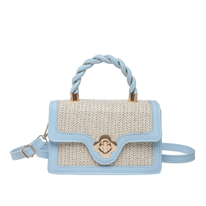 Light blue and beige straw texture crossbody bag with gold flower twist lock closure
