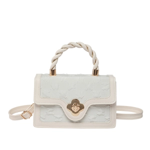 Beige faux leather handbag with twisted handle and floral gold buckle in square shape