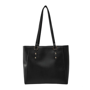 Sleek black faux leather tote bag with gold ring hardware and elegant shoulder straps