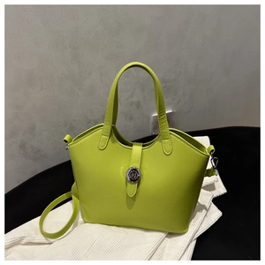 Detailed macro view of lime green bucket bag featuring a silver metal buckle and strap