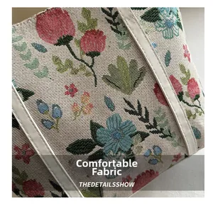 Macro shot of the jacquard fabric texture with floral patterns and white leather trim