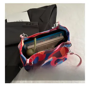Top view of color-block canvas tote bag showing large capacity for laptop and daily items