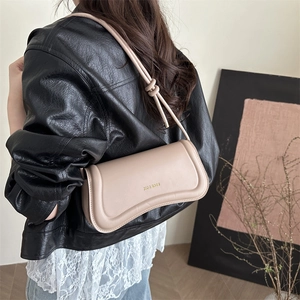 Minimalist beige leather baguette shoulder bag with gold KM & BAGS logo and knotted strap