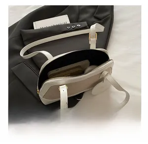 Top view of canvas tote bag interior showing capacity for daily essentials and zipper closure