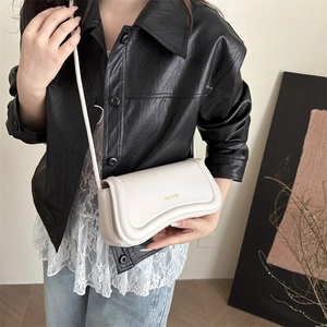 Chic cream white crossbody bag with gold lettering and adjustable shoulder strap