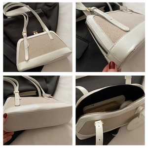 Detail view of linen patchwork boston bag with gold hardware and interior capacity