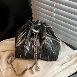 Fashionable denim bucket bag with silver sequins, chain strap and pearl drawstring charms