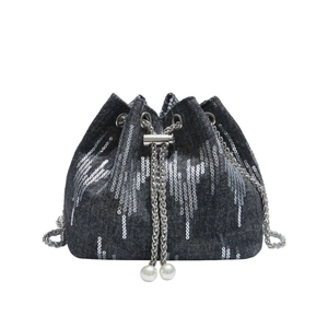 Dark grey denim bucket bag with silver sequin tassels, metal chain, and pearl charms