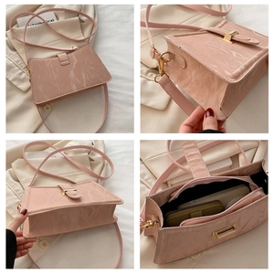 Detail views of pink glossy marble texture shoulder bag with gold metal buckle and interior