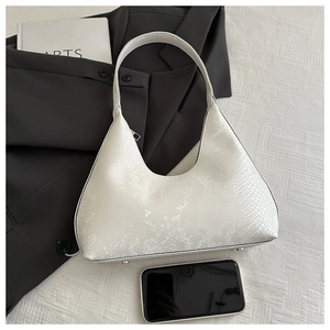 White snakeskin embossed half-moon Hobo bag shown with a smartphone for scale reference