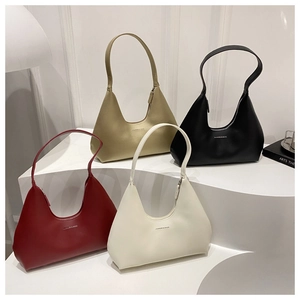 Minimalist hobo bags shown in red, champagne gold, black, and off-white on a white display