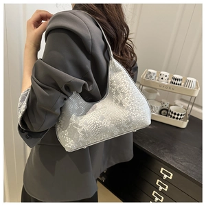 Detailed view of silver metallic snakeskin texture on a hobo shoulder bag for women