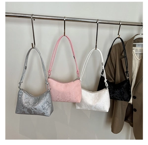 Detail showing snake pattern embossed hobo bags in silver, pink, beige and black