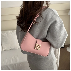Detail of pink leather handbag with iconic double F gold metal buckle for a premium look