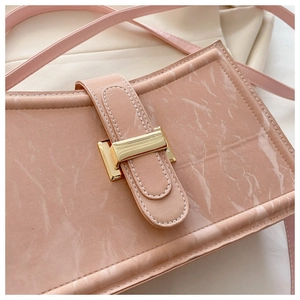 Macro shot of pink marble pattern faux leather with premium gold metal buckle detail