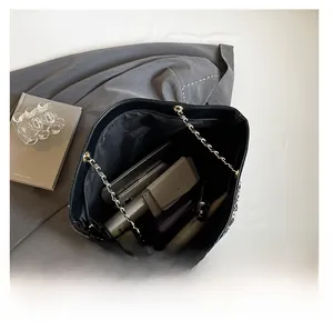Internal view of large crocodile pattern tote bag showing space for laptop and cosmetics