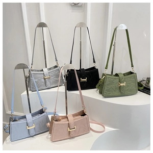 Detailed display of assorted crinkled leather shoulder bags with gold H buckle