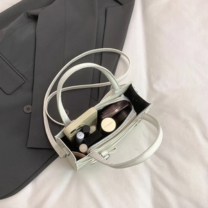 Elegant cream white mini square handbag with bow accent and interior storage capacity