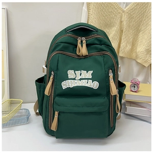 Macro detail of the dark green nylon backpack with white SJM SIJIMIAO lettering