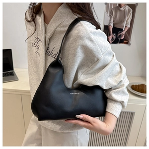 Close-up of black matte PU leather hobo bag with Fashion & Bags printed text detail