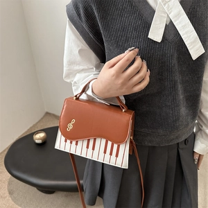 Fashionable brown piano key square bag with golden music note and shoulder strap