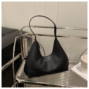 Detail of minimalist black hobo underarm bag with Fashion & Bags logo on soft PU leather