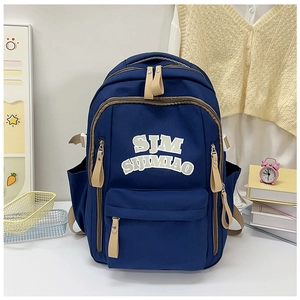 Detailed view of deep blue nylon backpack with SJM SIJIMIAO text and leather zip pulls
