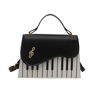 Fashionable piano keyboard theme handbag with musical note detail and adjustable strap