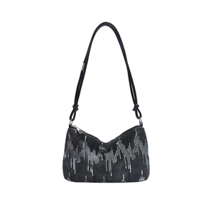 Chic black sequin underarm bag with silver wave pattern and knotted leather shoulder strap