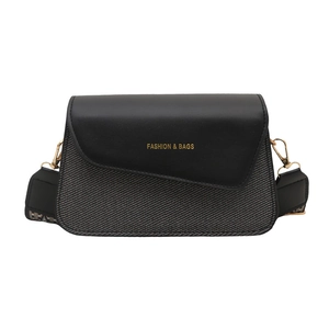 Minimalist black and grey color-block crossbody bag with wide patterned strap and gold hardware