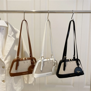 Chic canvas and leather patchwork tote bags in brown, white, and black colors for women