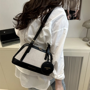 Canvas and leather patchwork tote bag for women with elegant black contrast trim