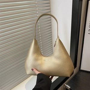 Champagne gold crescent hobo bag with sparkling metallic finish and fashion print