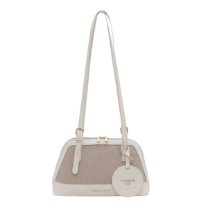 Minimalist canvas and beige leather patchwork tote bag with gold hardware for women