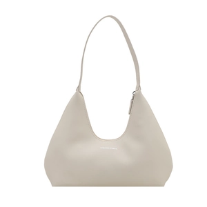 Minimalist cream white half-moon hobo bag in soft leather with thin shoulder strap