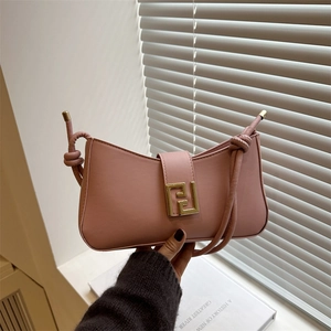 Pink minimalist crossbody bag with golden square buckle and knotted shoulder strap