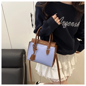 Blue lychee leather shoulder bag with brown handles and Fashion & Bags text detail