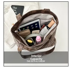 Detail view of large tote bag interior showing multi-layer compartments and high capacity