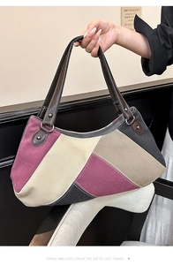 Detail der Canvas-Hobo-Tasche im Farbmix mit Ledergriff und Nietendetails
