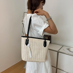 Large straw tote bag with black contrast trim and white fringe tassel for women