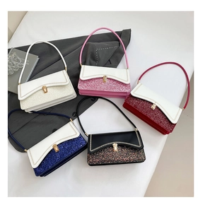 Detail view of five luxury leather handbags with shimmering glitter patchwork and metal locks