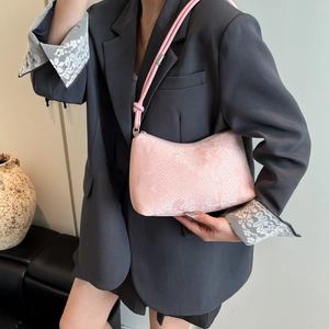Elegant light pink snakeskin embossed shoulder bag for women with minimalist curved design
