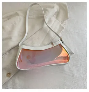 Detail of white leather shoulder bag with iridescent panel and sleek gold zipper