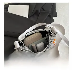 Internal view showing the spacious storage capacity of this white flower baguette bag
